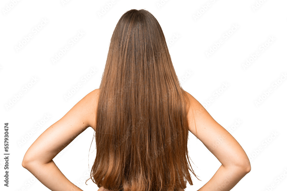 Young blonde woman over isolated chroma key background in back position Young blonde woman over isolated chroma key background in back position