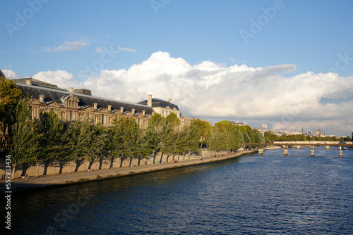 The Louvre museum on the right bank of the Seine river photo