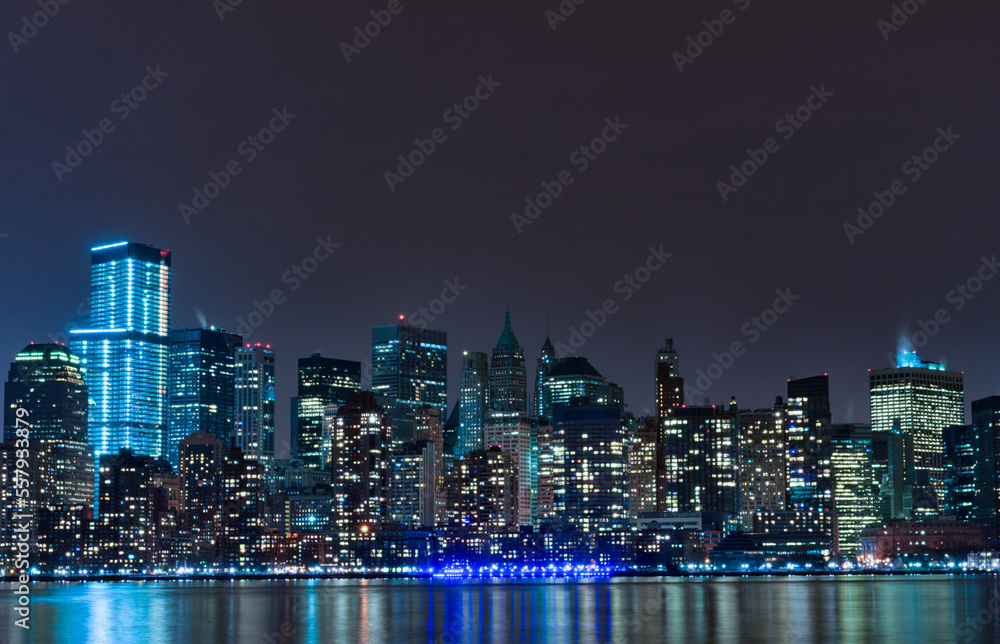 Hudson River and Night Cityscape of New York. Manhattan. NYC, USA. Reflection on Water