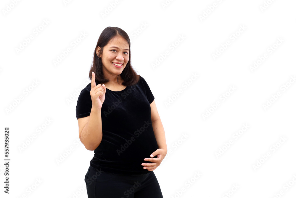 Happy Asian pregnant woman standing while showing a finger to pointing something. Isolated on white background Happy Asian pregnant woman standing while showing a finger to pointing something. Isolated on white background