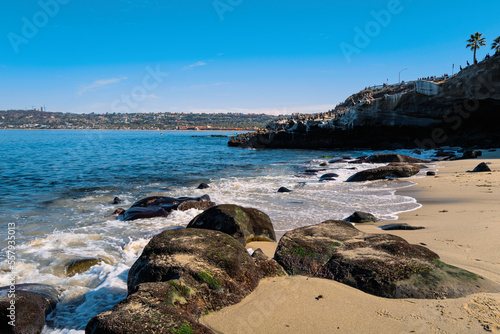 La Jolla Cove Beach Seascape  Rocky beachscape with white waves rolling in on the sand in La Jolla  San Diego  Southern California  USA