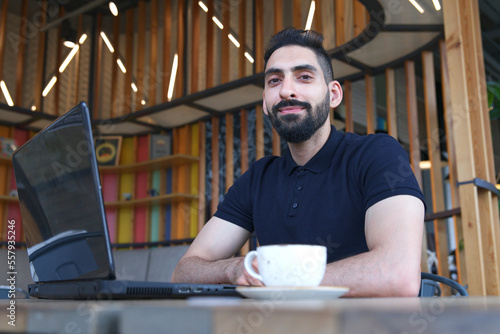 Portrait of Arab Arabian young handsome happy muslim bearded man with beard in casual clothes, islamic person 