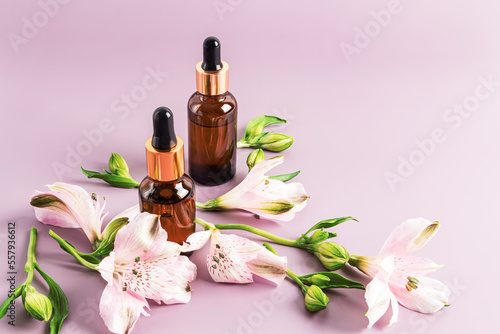 cosmetic bottles with anti-aging facial skin care products. serum with peptides. natural cosmetics. pastel background.