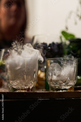 Cocktail preparation with dry ice or carbon snow, CO2. Mixology concept.