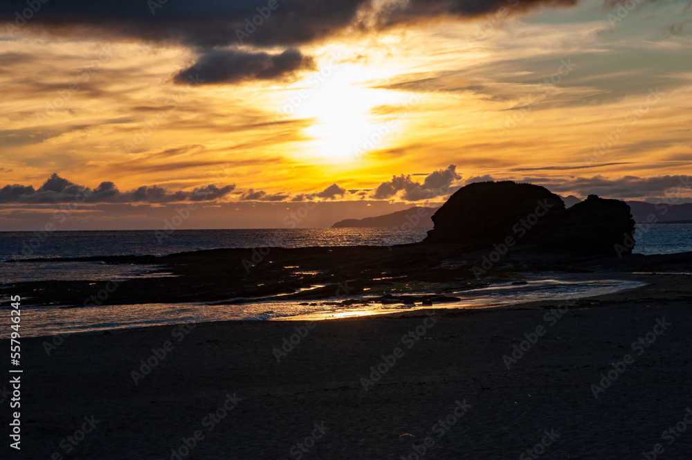 Sandy beach on sunset in Bundoran town, Ireland