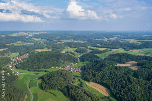 View from a motor glider over the picturesque landscape of Franconian Switzerland/Germany with small villages