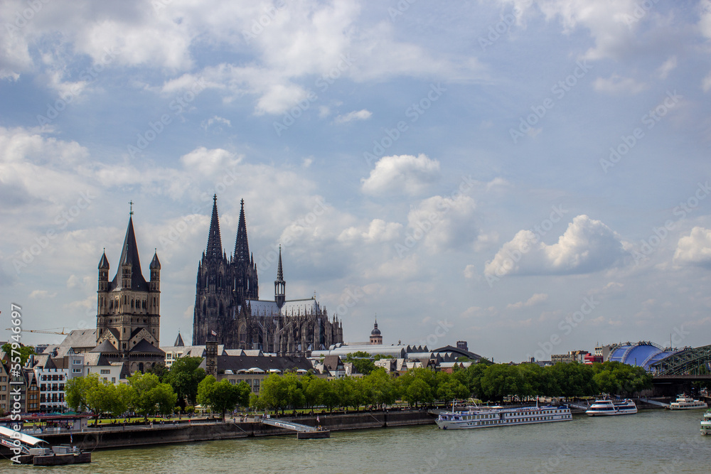 Cityscape of Cologne with Hohenzollern bridge, cathedral, Saint Martin church and Rin river in Germany