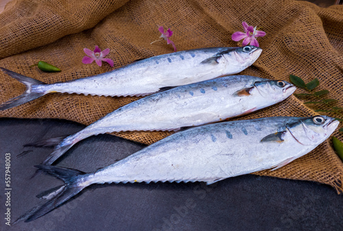 Selective focus of Doublespotted queenfishFish decorated on a wooden pad. photo