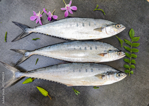 Selective focus of Doublespotted queenfishFish decorated on a wooden pad.