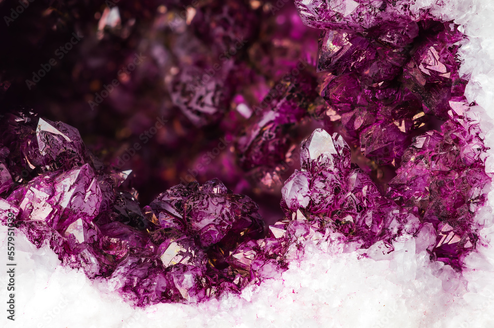 artificially stained (painted) quartz to look like an amethyst. pink, purple, violet, macro detail texture background. close-up raw rough unpolished semi-precious gemstone. artificially stained (painted) quartz to look like an amethyst. pink, purple, violet, macro detail texture background. close-up raw rough unpolished semi-precious gemstone.