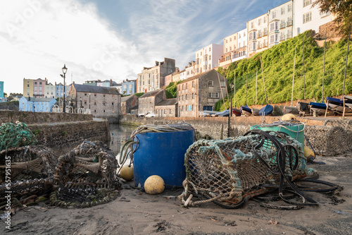 Fishing equipment on a quay side, in a traditional British fishing village.  The location is Tenby, on the southern coastline of Wales photo