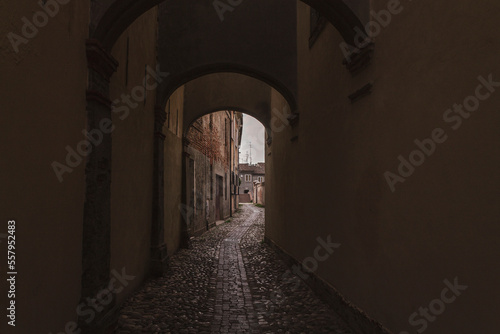 High angle view of a narrow street in Ferrara  Italy. Contrast between medieval architecture and modern buildings. Copy space.