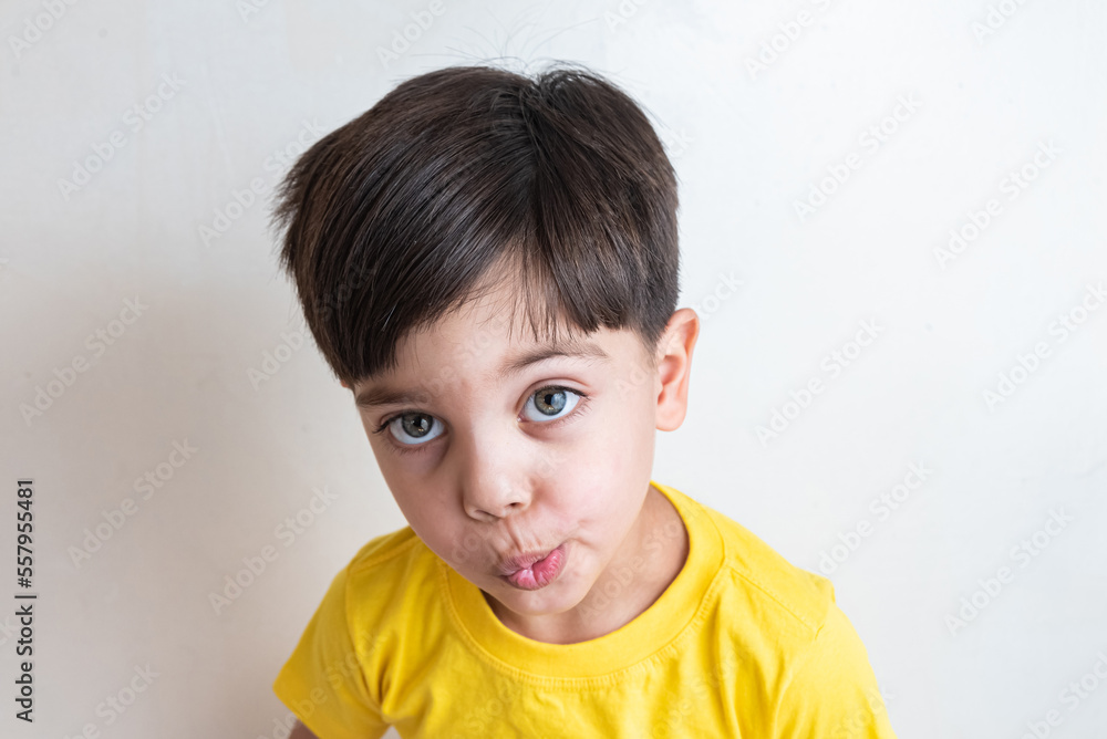 Cute and happy boy with yellow t-shirt Cute and happy boy with yellow t-shirt
