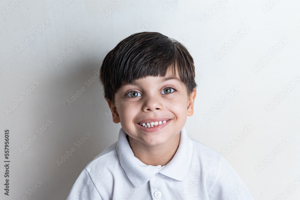 Cute boy with white shirt on white background Cute boy with white shirt on white background