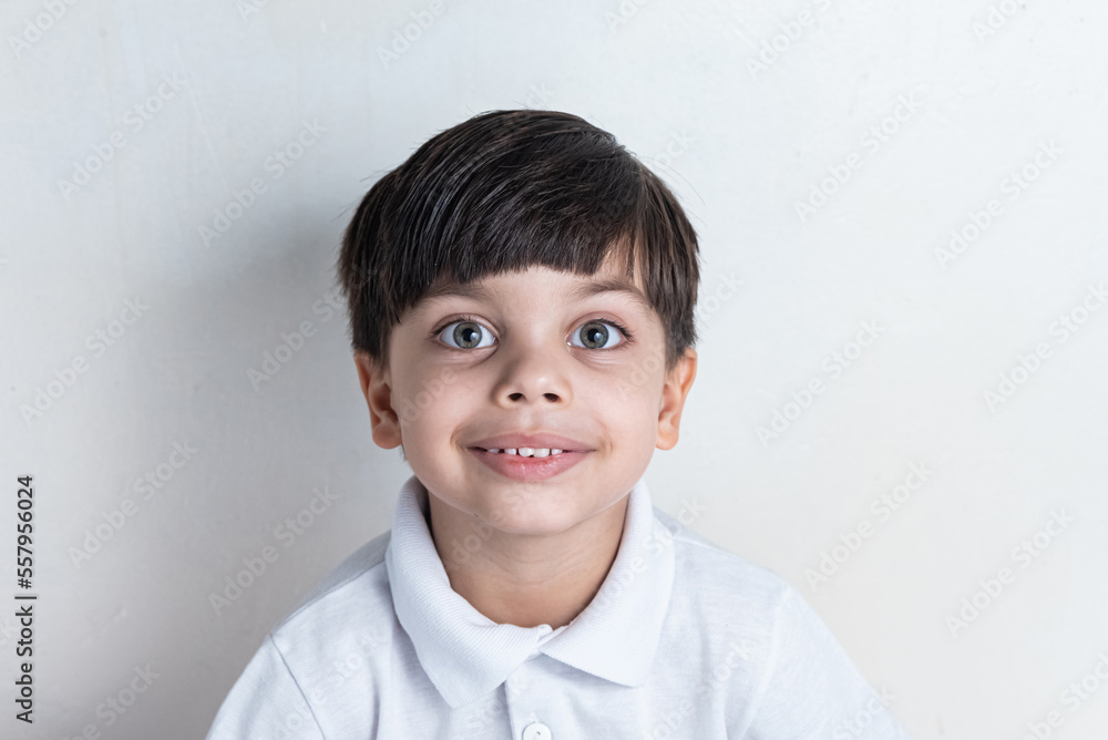 Cute boy with white shirt on white background Cute boy with white shirt on white background