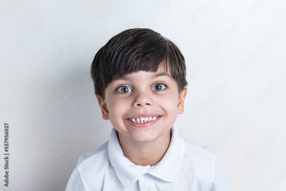Cute boy with white shirt on white background Cute boy with white shirt on white background