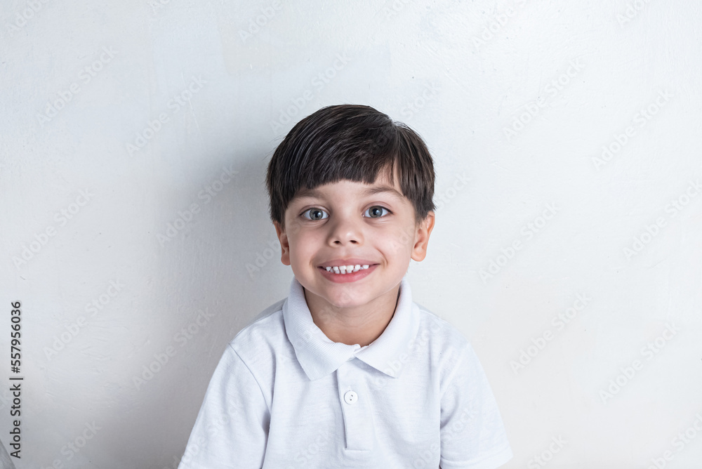 Cute boy with white shirt on white background Cute boy with white shirt on white background