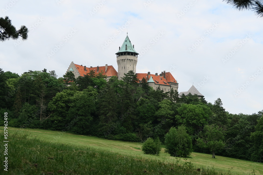 castle of smolenice with grey stones and green nature surounded by green forest
