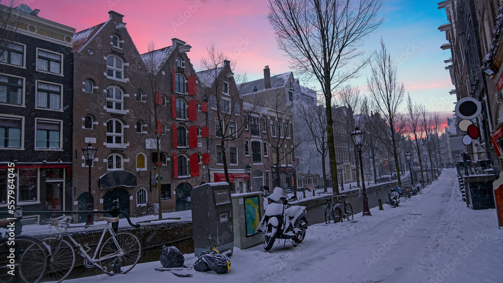 Snowy Amsterdam at the red light district in winter in the Netherlands