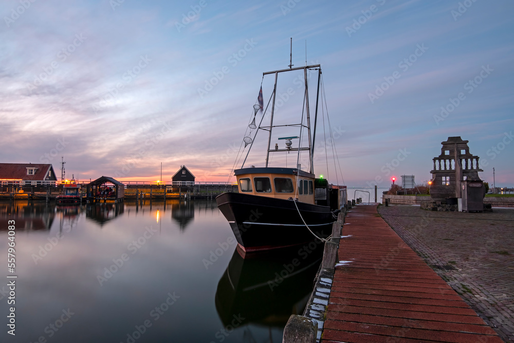 Harbor from the historical village Hindeloopen at the IJsselmeer in Friesland the Netherlands at sunset
