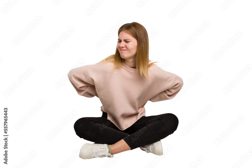 Fototapeta premium Young caucasian woman sitting on the floor cutout isolated