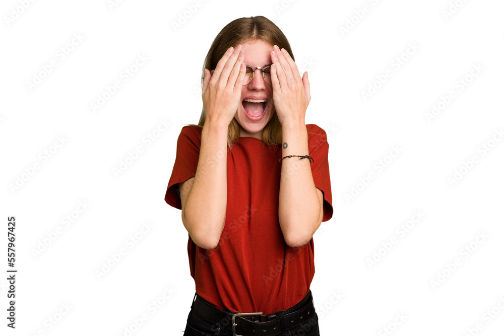 Young caucasian woman isolated having fun covering half of face with palm. Young caucasian woman isolated having fun covering half of face with palm.