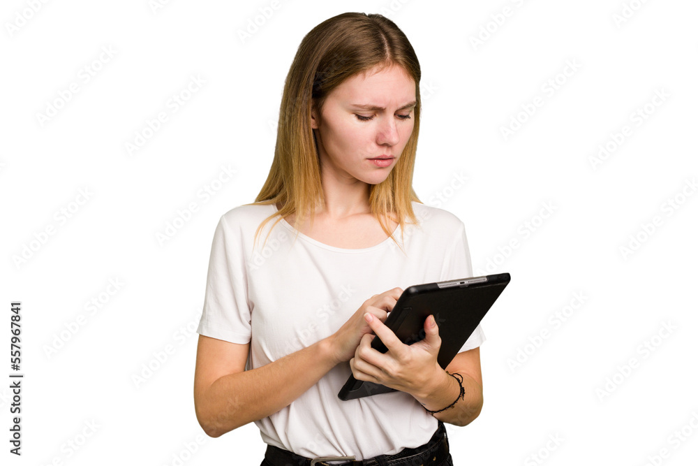Young caucasian woman using a tablet isolated Young caucasian woman using a tablet isolated