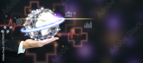 Man showing a globe with a network connecting points graphic in medical business concept.