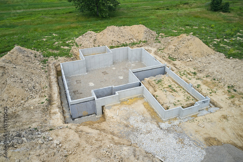 A foundation for a new house. The basement is already poured with concrete. photo