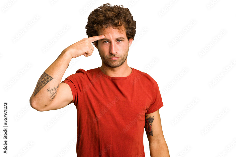 Young curly smart caucasian man cut out isolated pointing temple with finger, thinking, focused on a task. Young curly smart caucasian man cut out isolated pointing temple with finger, thinking, focused on a task.