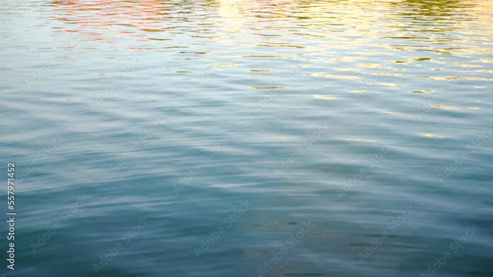 Shot of calm water surface of a river. Guadalquivir river in Seville, Spain. Shot of calm water surface of a river. Guadalquivir river in Seville, Spain.