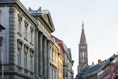 Majestic view of French Notre-Dame de Strasbourg cathedral and beautiful expensive real estate apartment buildings in central Strasbourg - impressive view of the Haussmannian architecture