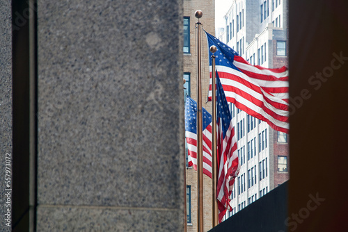 Obraz na płótnie Flags of the United States waving in the wind in New York City w salonie