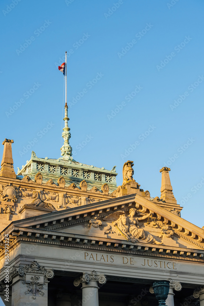 Palais de Justice in central Strasbourg with French tricolour flag waving clear blue sky over the renovation justice building