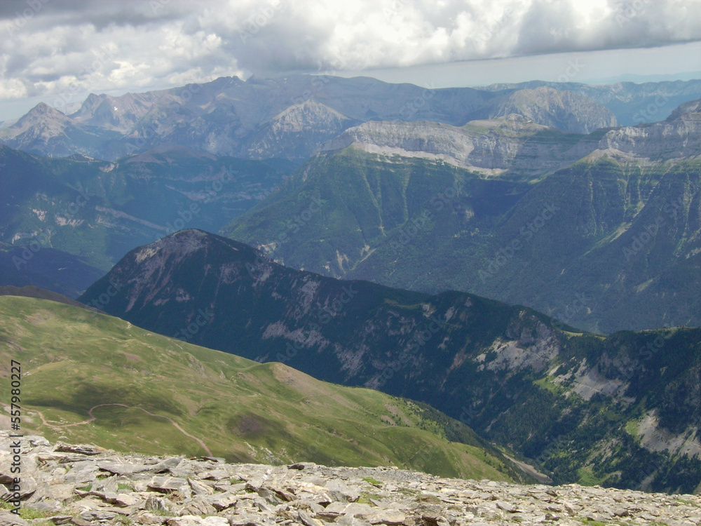 mountainous landscape of the Spanish Pyrenees. lots of green vegetation and high mountains.