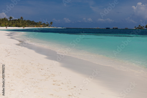 Fototapeta Naklejka Na Ścianę i Meble -  Bungalow on a tropical island with palm trees