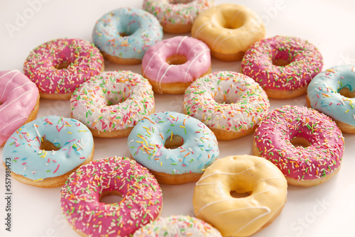 Colorful delicious donuts isolated on white background