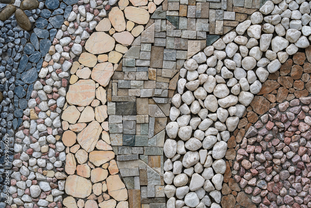 Naklejka premium Pebble stone wall texture background or texture, close up