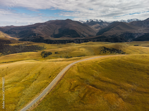 Car Moving among Green Hills and Forest. photo