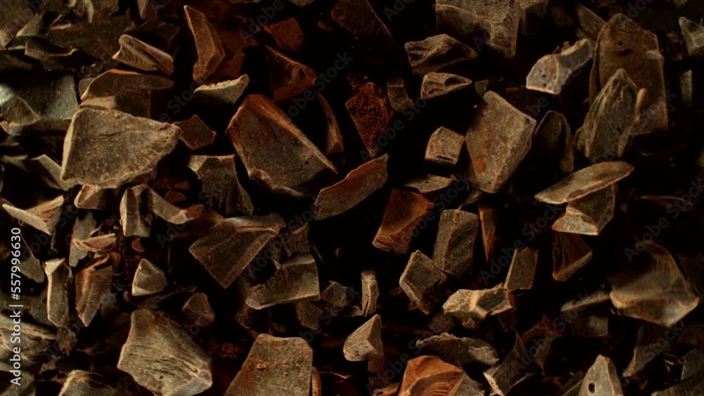 Super slow motion of rotating group of raw chocolate pieces. Super fast camera motion. Filmed on high speed cinema camera, 1000fps, placed on high speed cine bot. Super slow motion of rotating group of raw chocolate pieces. Super fast camera motion. Filmed on high speed cinema camera, 1000fps, placed on high speed cine bot.