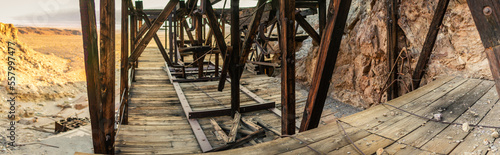 Rusty dark beams in constraction unused historic gold mine with iron hooks in Death Valley in america