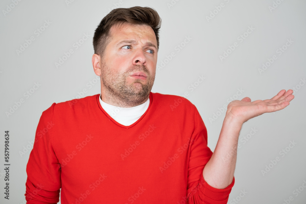 man clueless and confused expression with arms and hands raised. man clueless and confused expression with arms and hands raised.