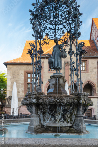 Gaenseliesel fountain with the old town hall in the background, the landmark of Goettingen photo