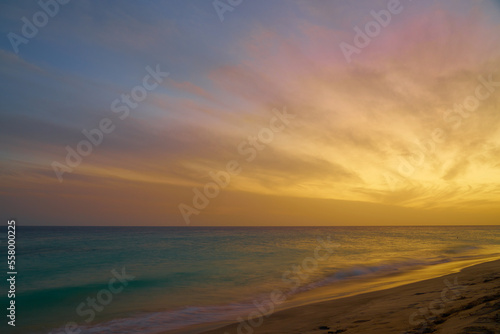 A colorful sunset on the Atlantic coast on the island of Sal in Cape Verde. © Arthur