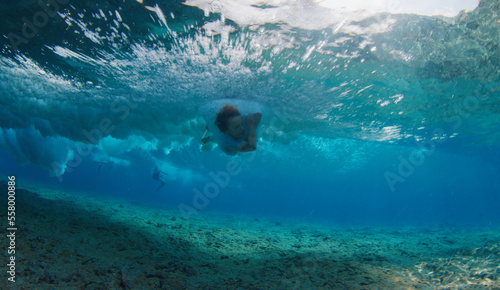 Photography Boy surfer falls into the water during surfing