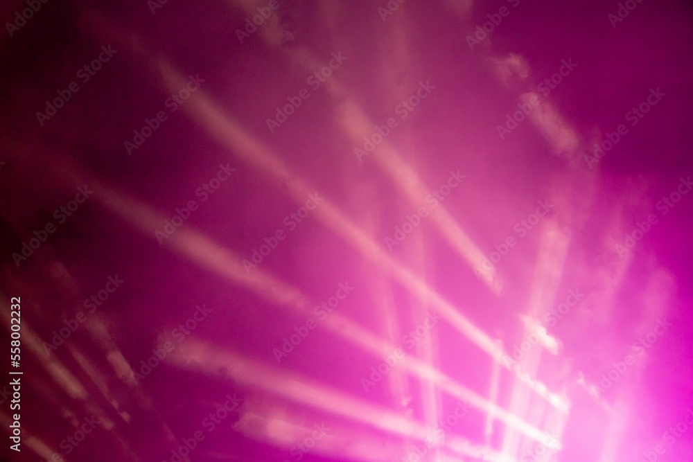 Laser show. Night club, lights, smoke machine. Pink background