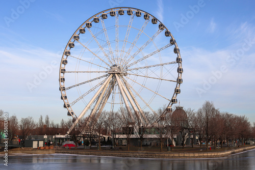 Montreal tourism - ferris wheel  details  on  blue sky background. Amusement park  festive mood. viewpoint