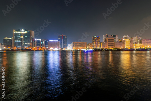Dubai Creek skyline illuminated at night in Dubai  United Arab Emirates.
