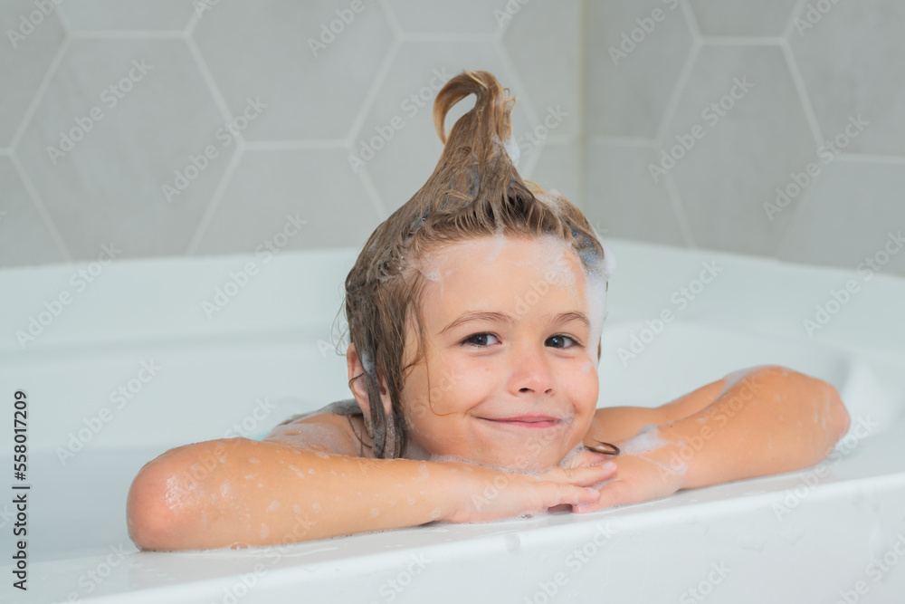 Children bathing. Funny bath. Kid washing with a bubbles in bath. Cute