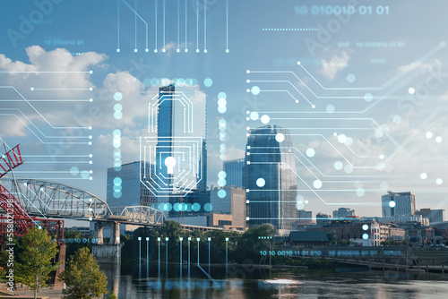Panoramic skyline view of Broadway district of Nashville over Cumberland River at day time, Tennessee, USA. Glowing Padlock hologram. The concept of cyber security to protect confidential information
